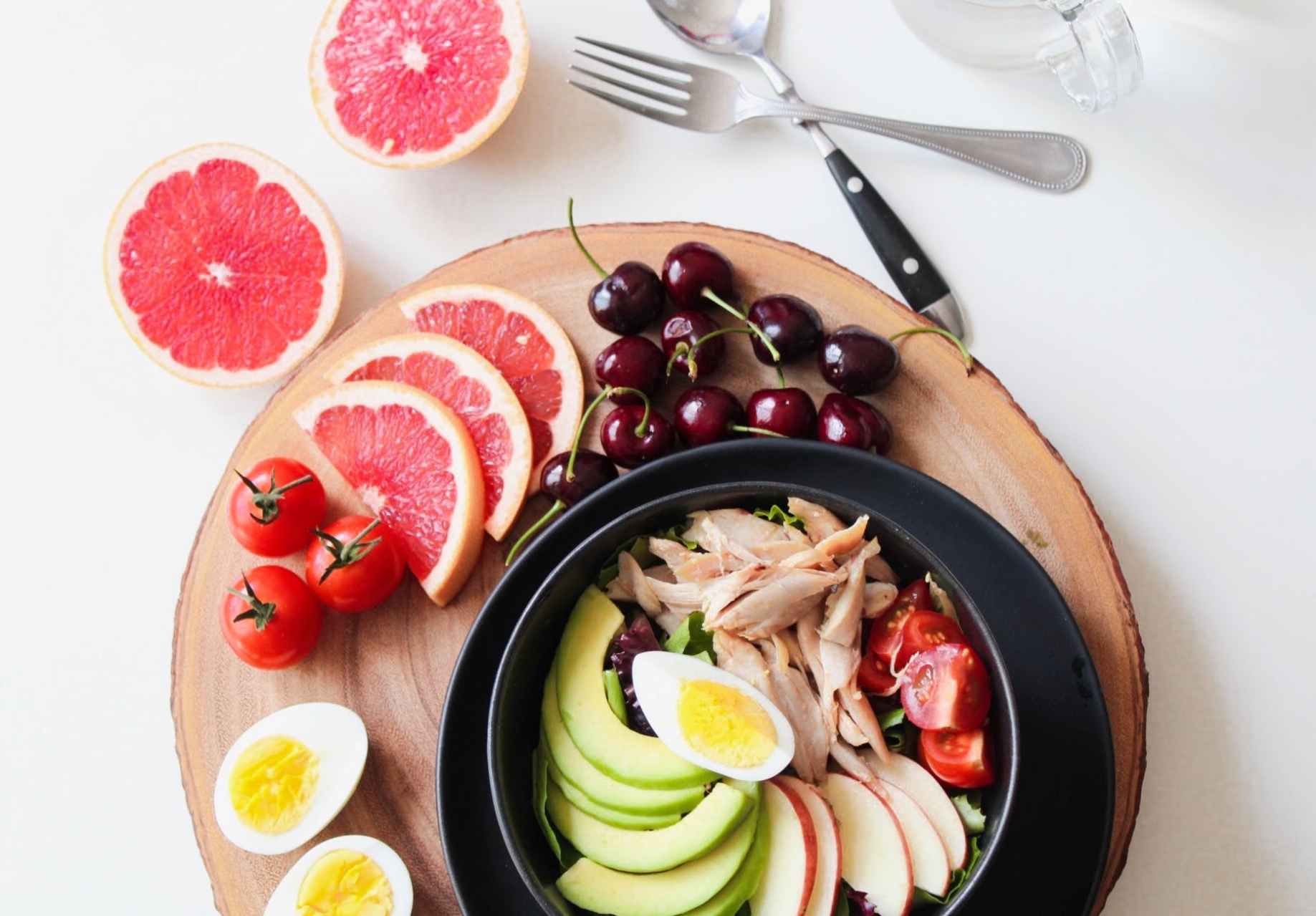 bowl of vegetable salad and fruits